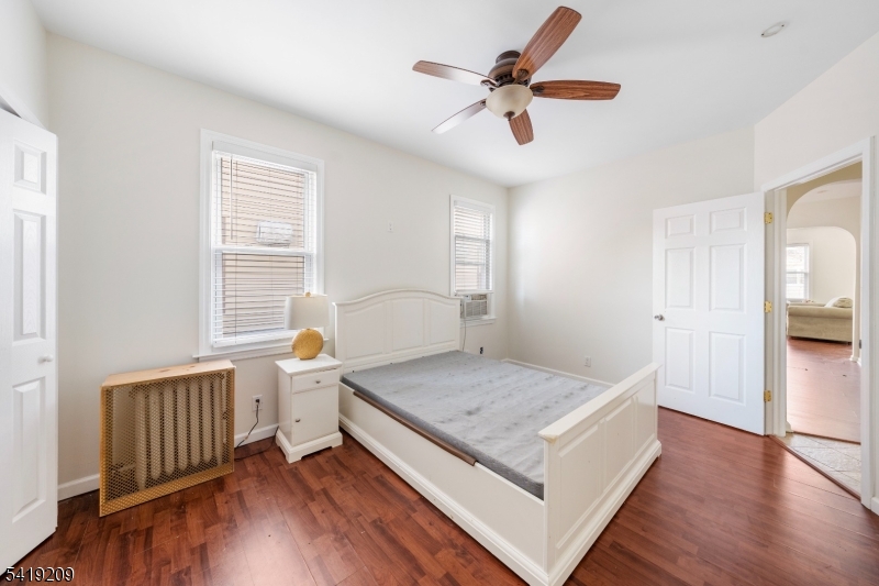 752 Eaton Street Elizabeth, NJ 07202 - Photo 15 of 27 a living room with a bed furniture and a window