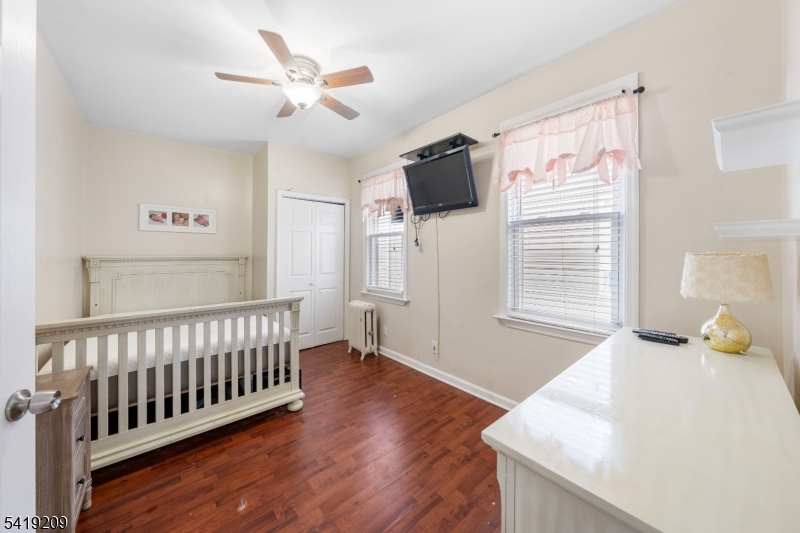 752 Eaton Street Elizabeth, NJ 07202 - Photo 16 of 27 a bedroom with furniture and a window