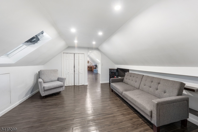 752 Eaton Street Elizabeth, NJ 07202 - Photo 18 of 27 a living room with furniture and wooden floor