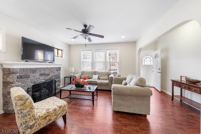 752 Eaton Street Elizabeth, NJ 07202 - Photo 5 of 27 a living room with furniture and a fireplace