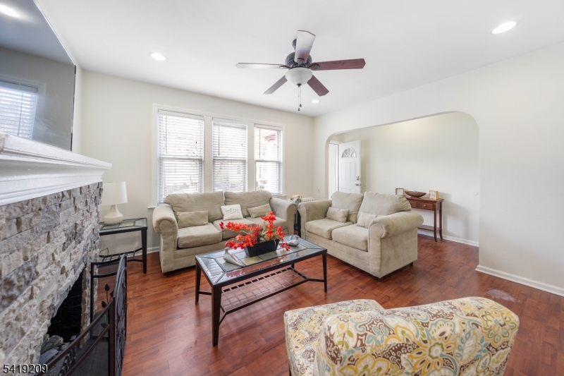 752 Eaton Street Elizabeth, NJ 07202 - Photo 7 of 27 a living room with fireplace furniture and a rug