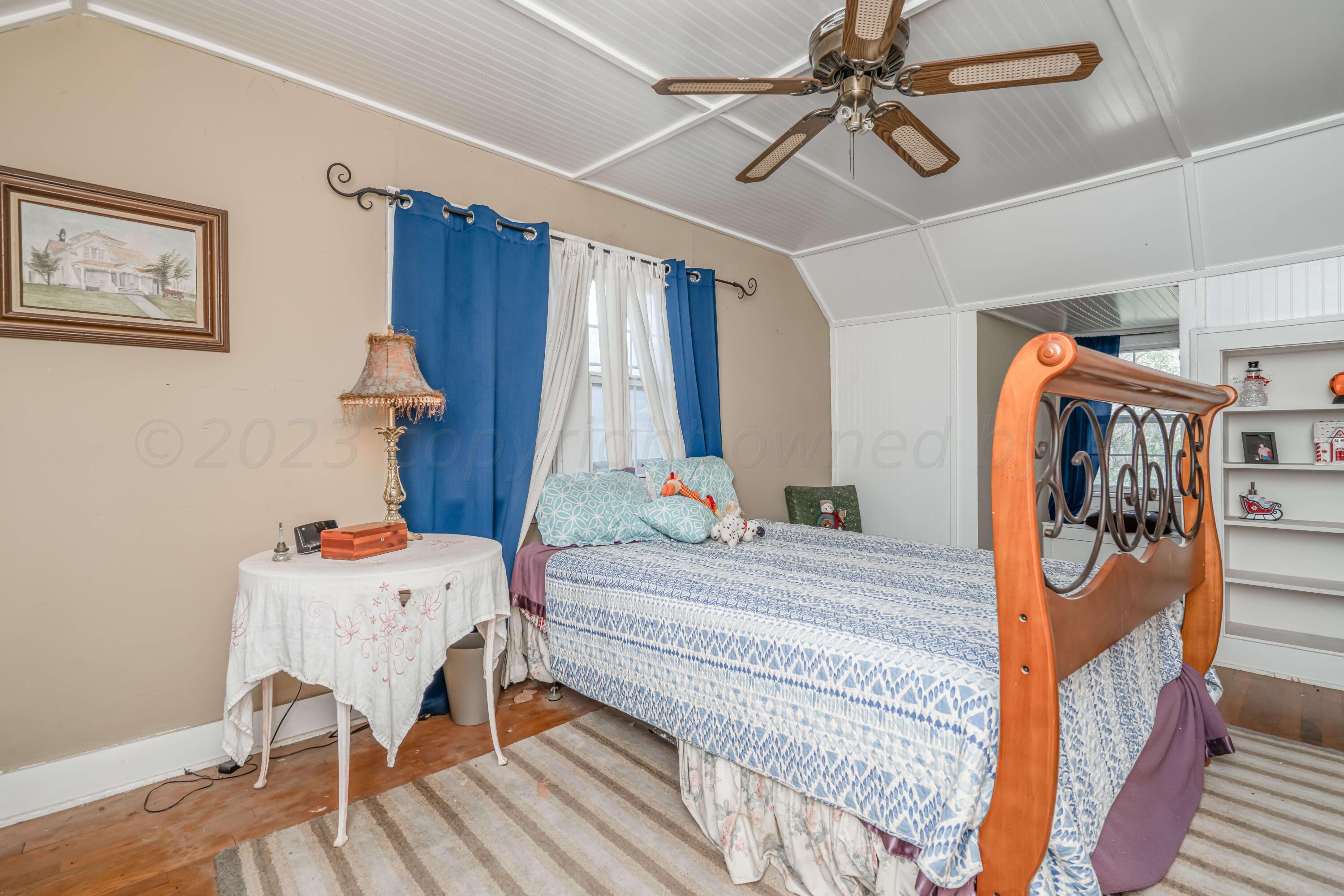 4809 Arden Road Amarillo, TX 79110 - Photo 25 of 34 a bedroom with furniture and a bed