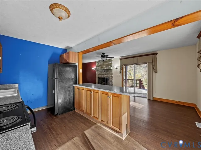a kitchen with a stove a sink and cabinets