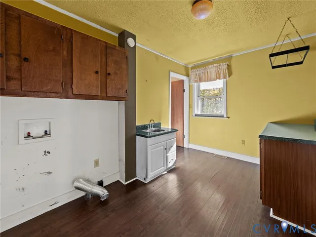 a kitchen with a refrigerator and a sink