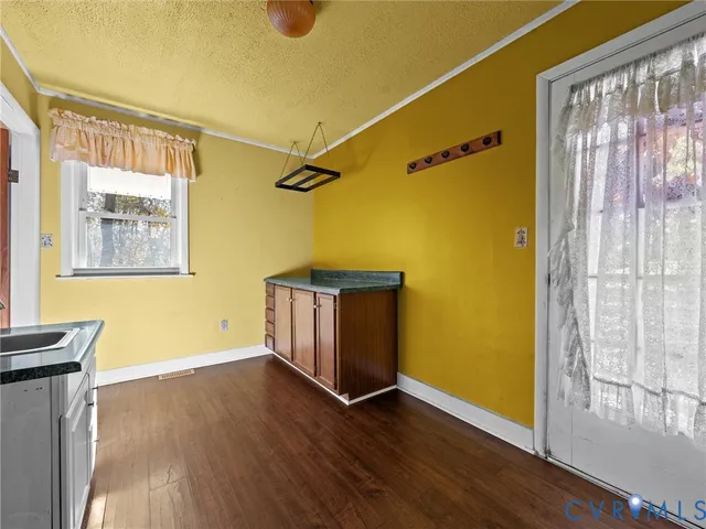 a view of walk in closet and window