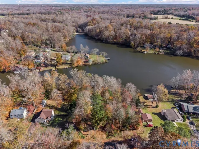 an aerial view of a house with a lake view