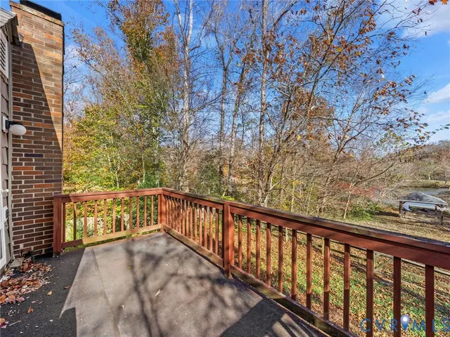 a view of a street with a bench in it