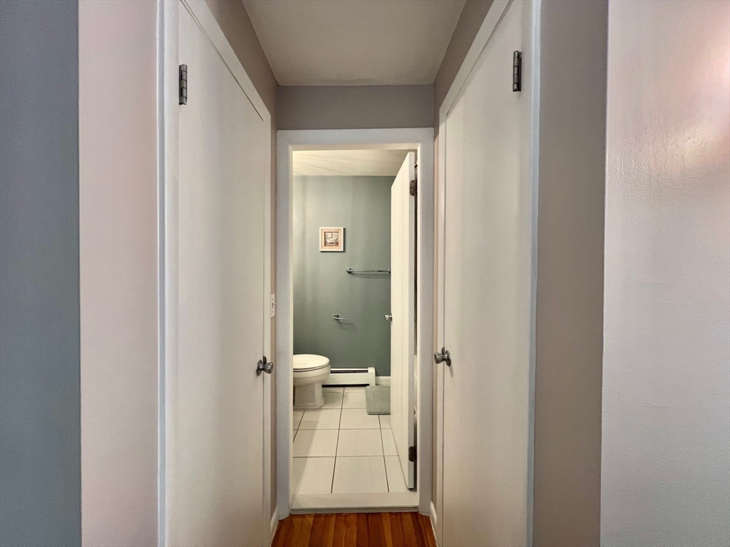 95 Maple Street, Unit 18 Malden, MA 02148 - Photo 18 of 24 a view of a bathroom from a hallway