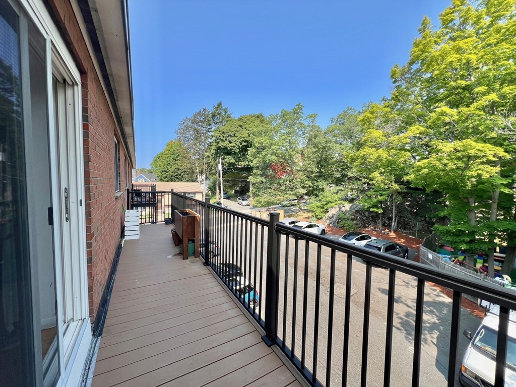 95 Maple Street, Unit 18 Malden, MA 02148 - Photo 20 of 24 a view of a balcony with wooden floor