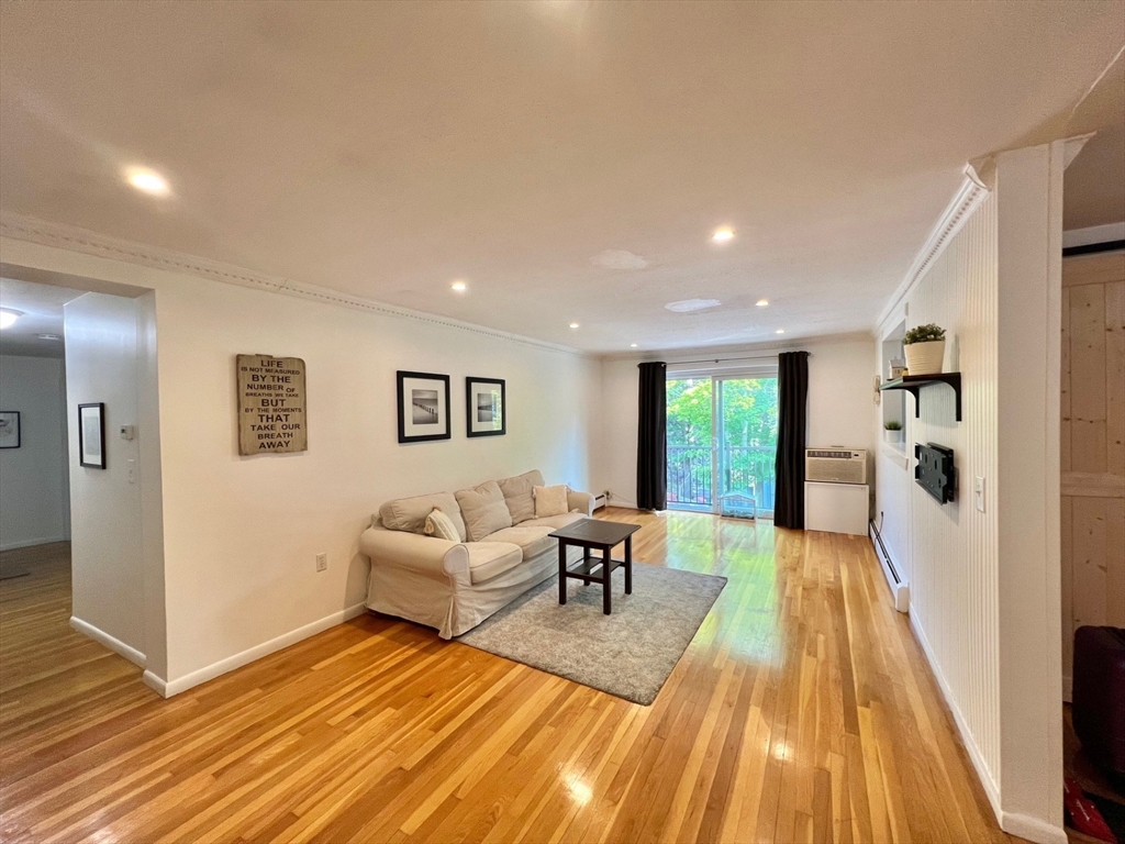 95 Maple Street, Unit 18 Malden, MA 02148 - Photo 5 of 24 a living room with furniture and a wooden floor