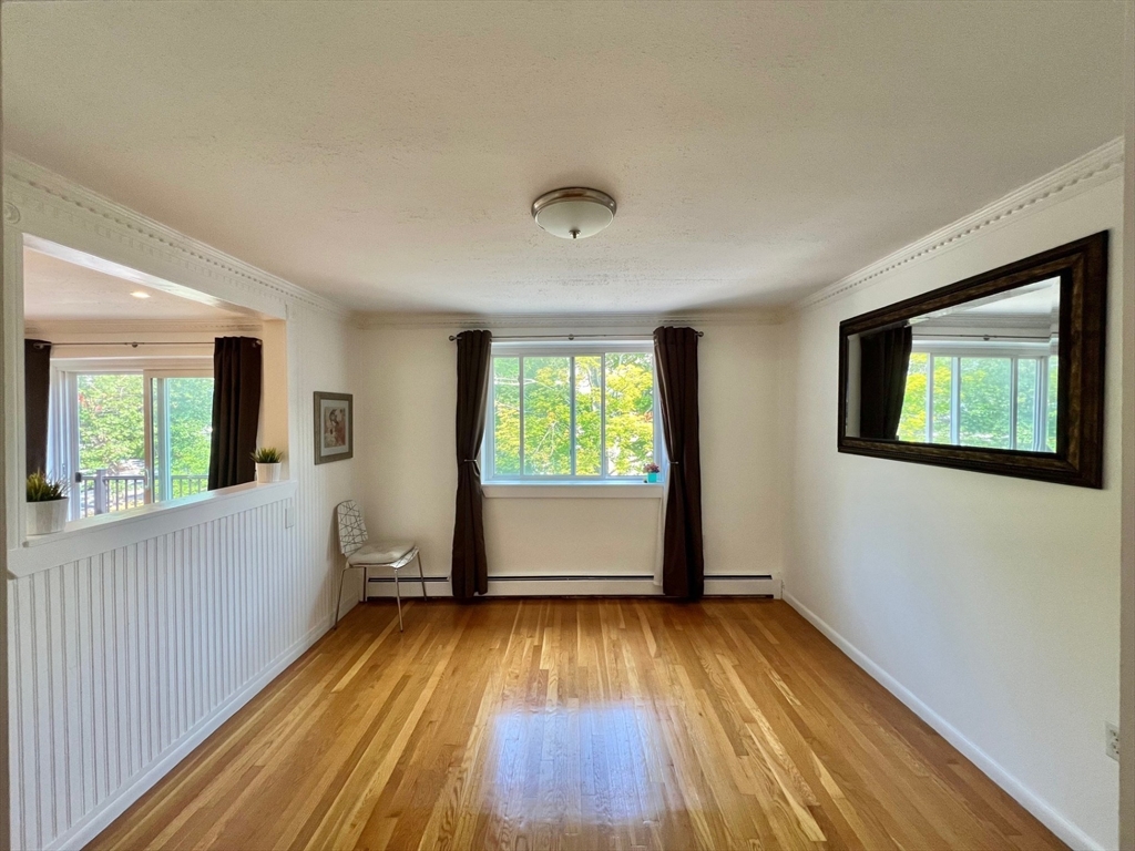 95 Maple Street, Unit 18 Malden, MA 02148 - Photo 7 of 24 wooden floor in an empty room with a window