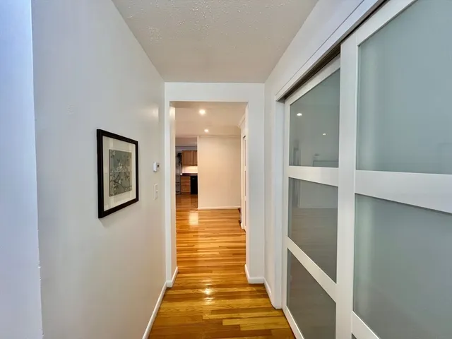 a hallway with wooden floor