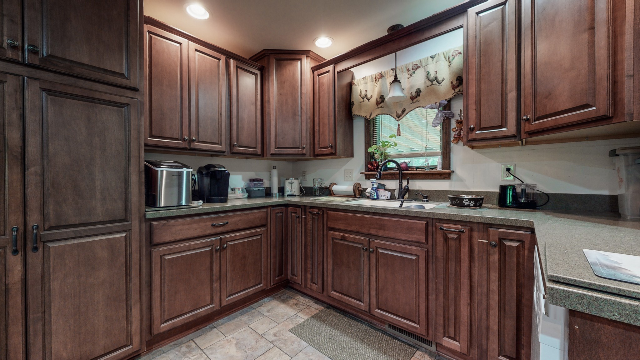 7707 Murfreesboro Road Lebanon, TN 37090 - Photo 14 of 45 a kitchen with stainless steel appliances granite countertop a refrigerator and sink