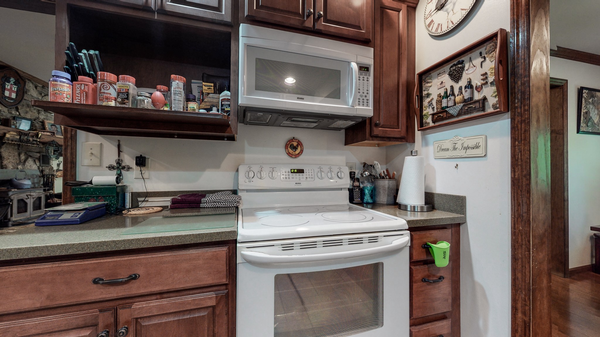 7707 Murfreesboro Road Lebanon, TN 37090 - Photo 15 of 45 a kitchen with stainless steel appliances granite countertop a stove and a microwave