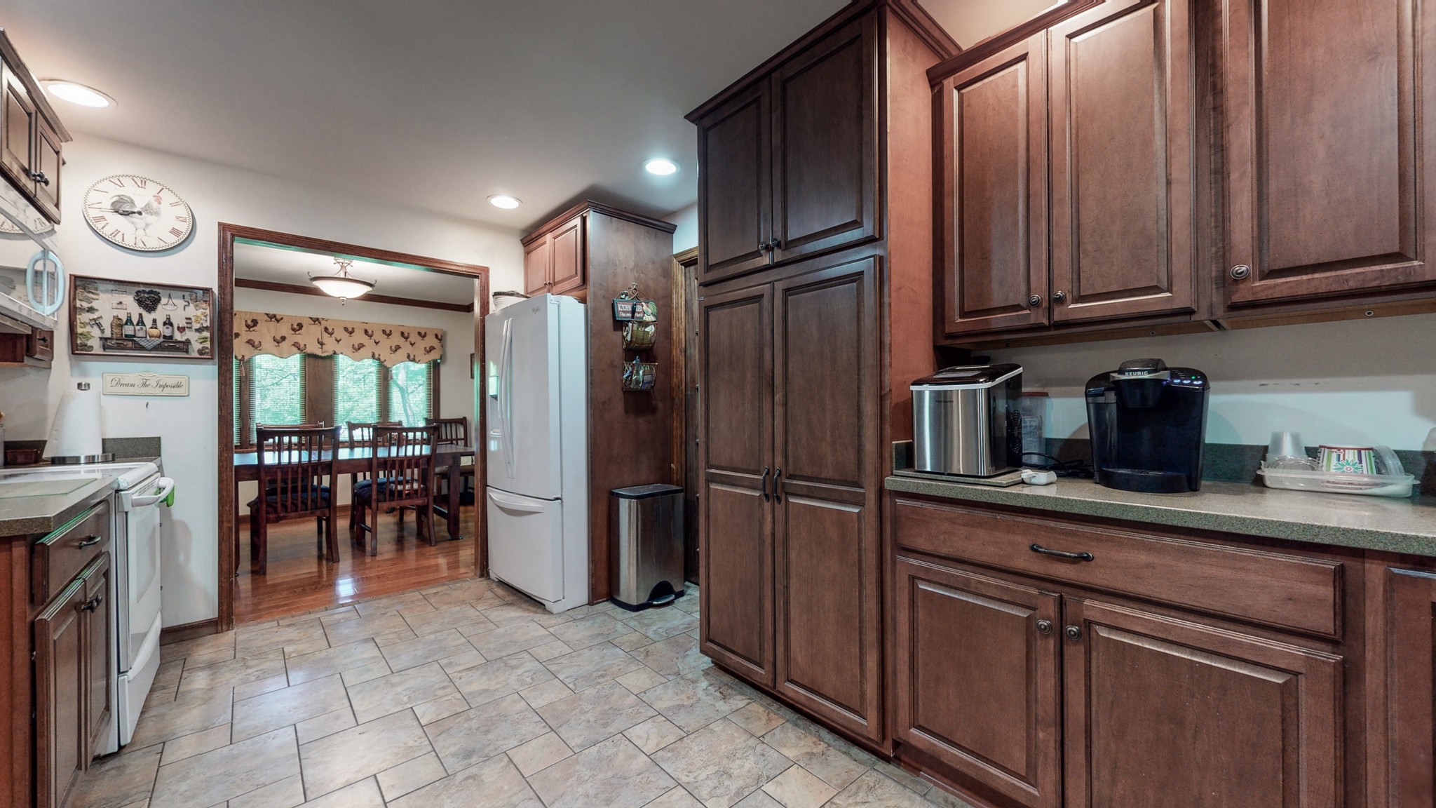 7707 Murfreesboro Road Lebanon, TN 37090 - Photo 18 of 45 a kitchen with refrigerator and cabinets