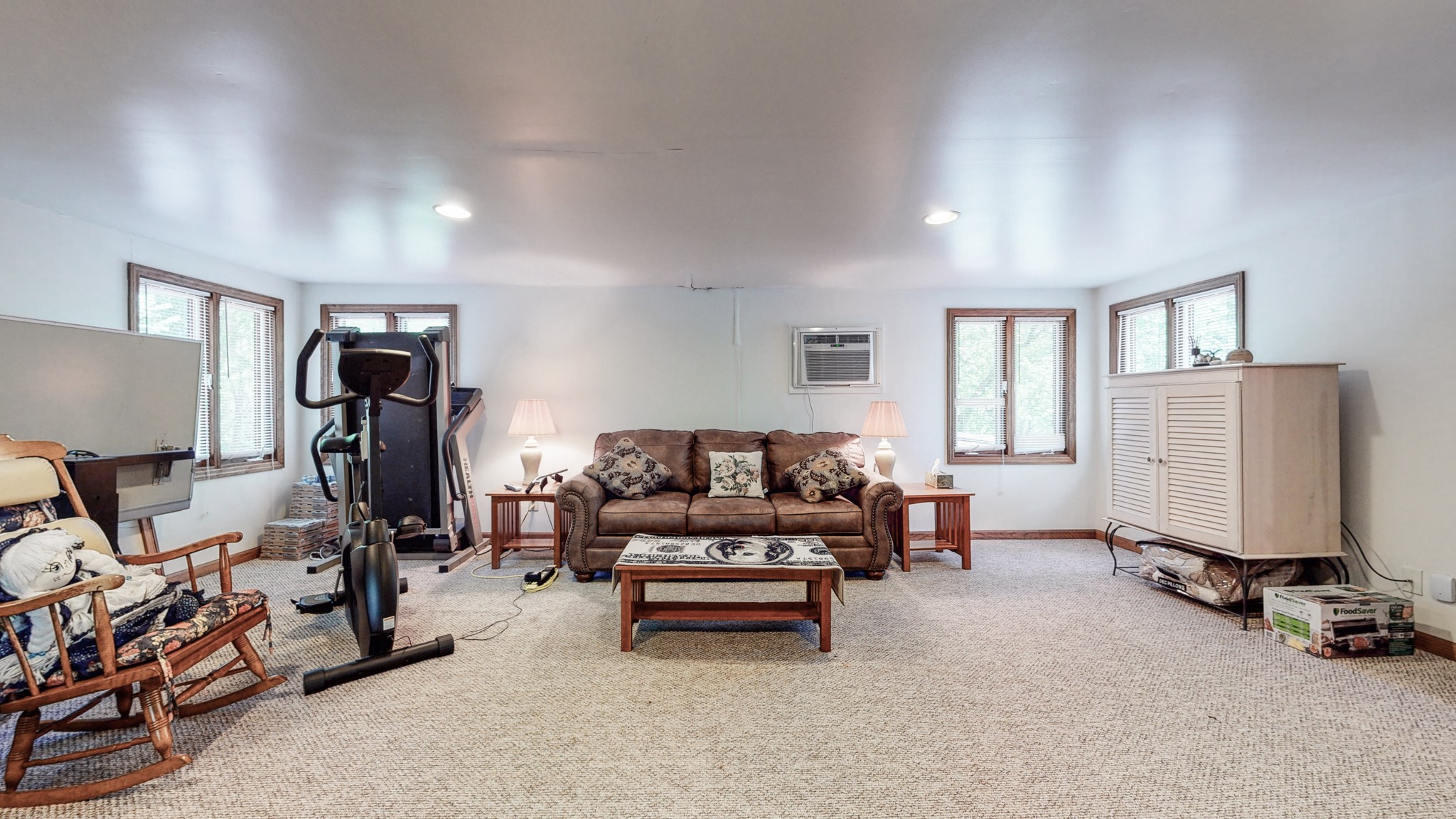 7707 Murfreesboro Road Lebanon, TN 37090 - Photo 35 of 45 a living room with furniture gym equipment and a window