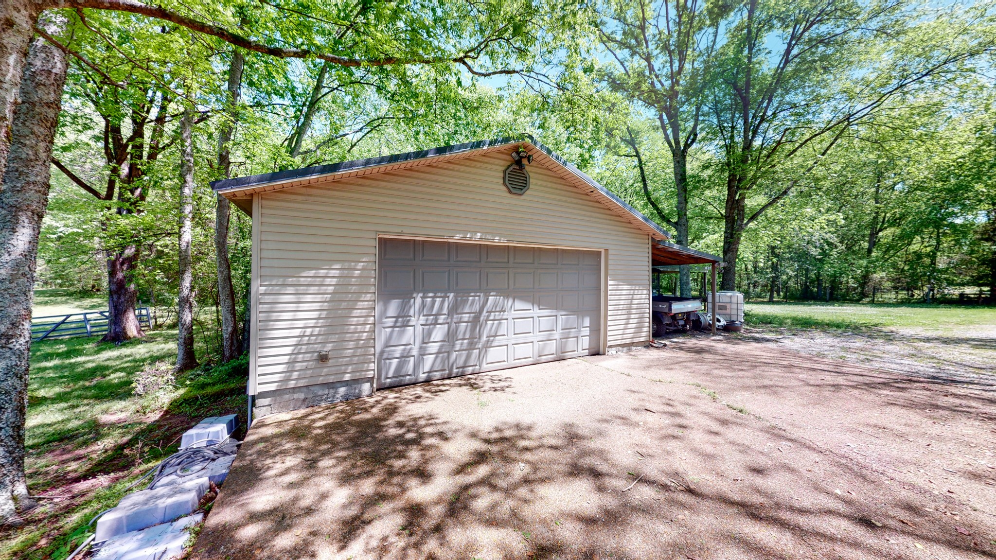 7707 Murfreesboro Road Lebanon, TN 37090 - Photo 38 of 45 a front view of a house with a yard and garage