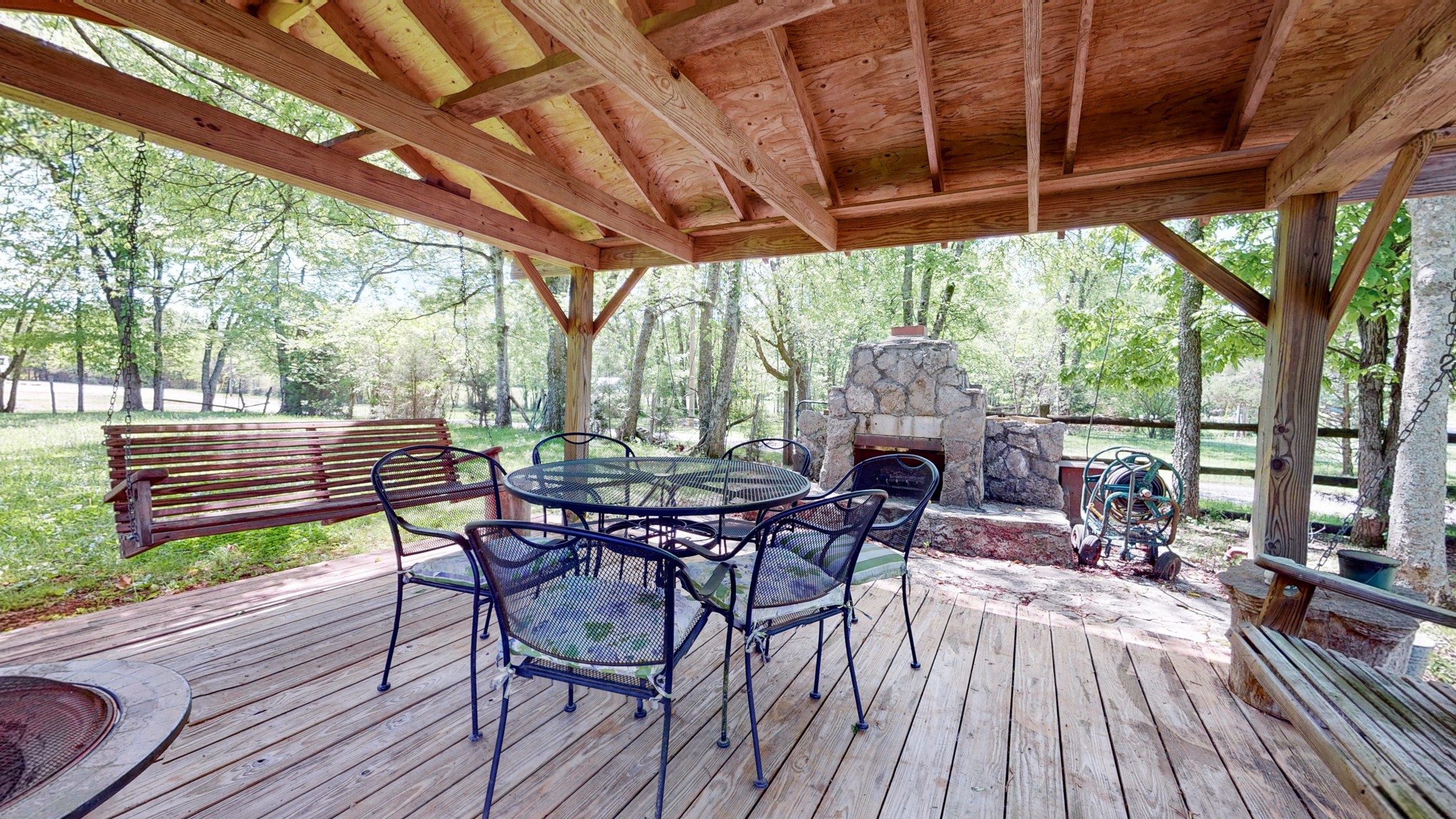 7707 Murfreesboro Road Lebanon, TN 37090 - Photo 43 of 45 a view of a patio with table and chairs and wooden floor