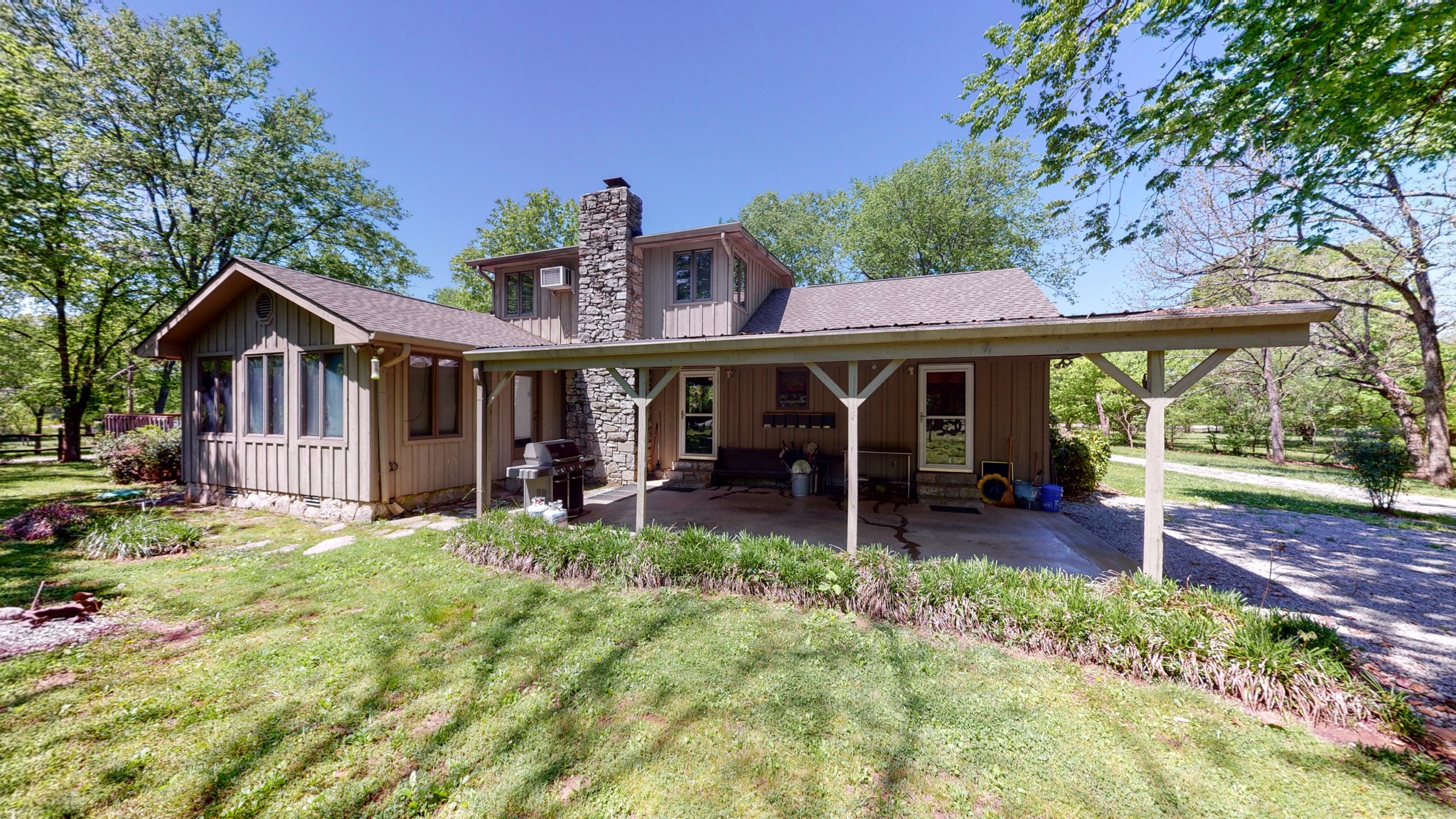 7707 Murfreesboro Road Lebanon, TN 37090 - Photo 6 of 45 a front view of a house with table and chairs in patio