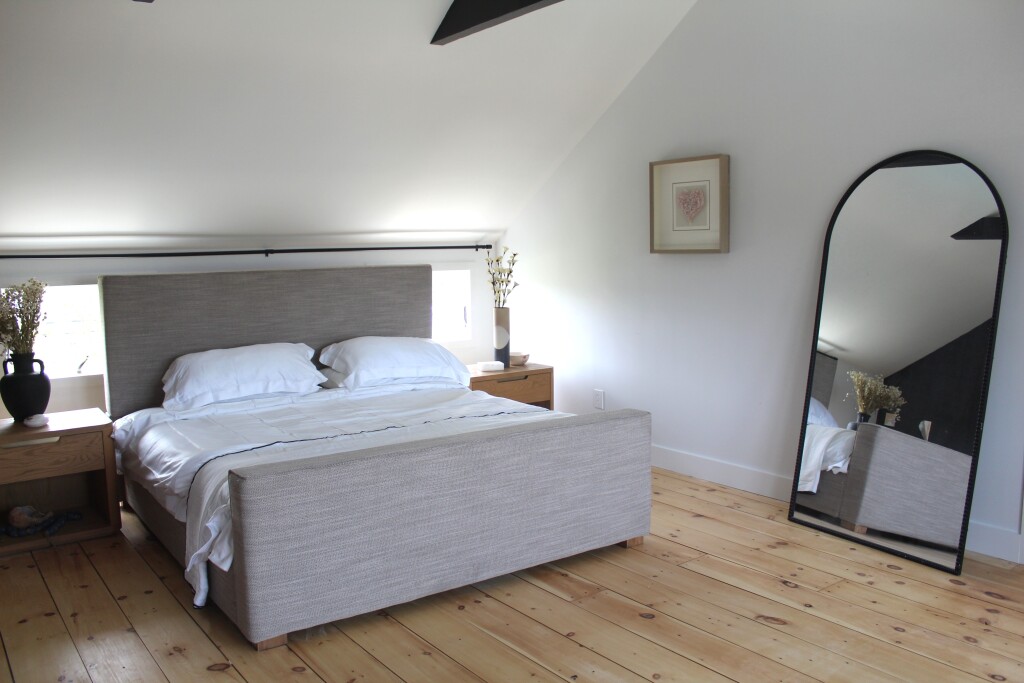 33 Bartlett Road Nantucket, MA 02554 - Photo 17 of 29 a bedroom with a bed and a mirror