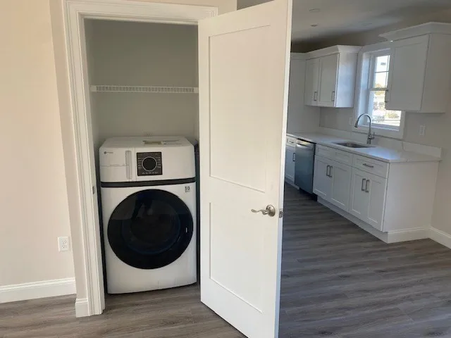 a view of a kitchen with washer and dryer