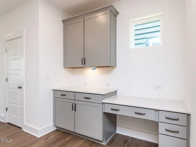 a view of cabinets with wooden floor