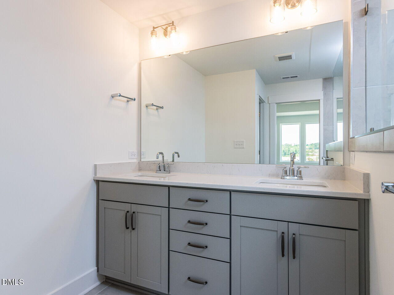 7 Tallgrass Road Pittsboro, NC 27312 - Photo 21 of 32 a bathroom with a sink and a mirror