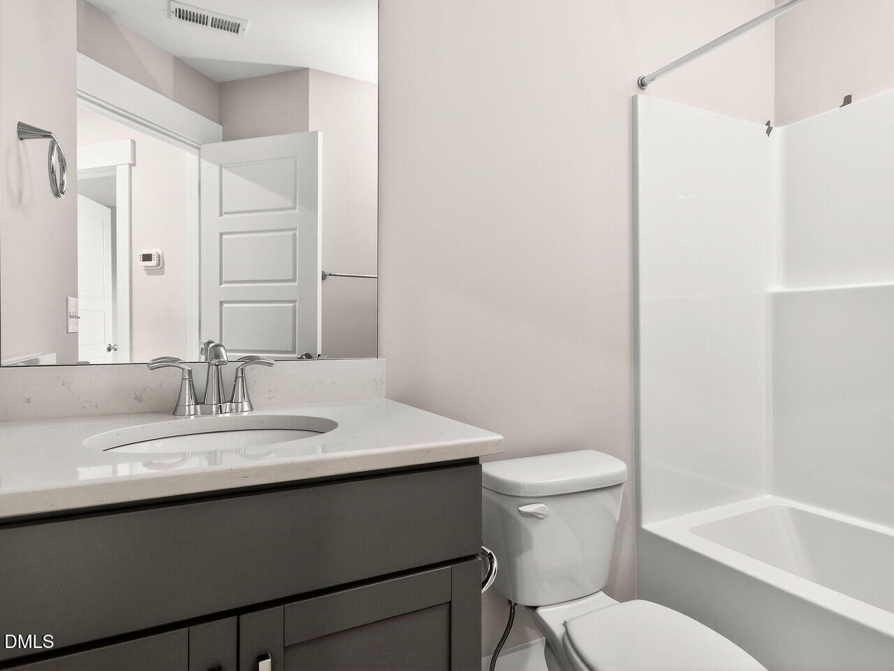 7 Tallgrass Road Pittsboro, NC 27312 - Photo 26 of 37 a bathroom with a sink a toilet a mirror and shower