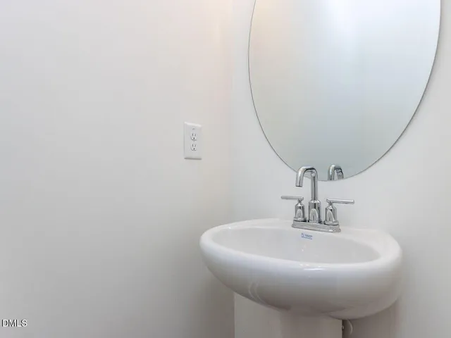 a close up of a sink and a mirror