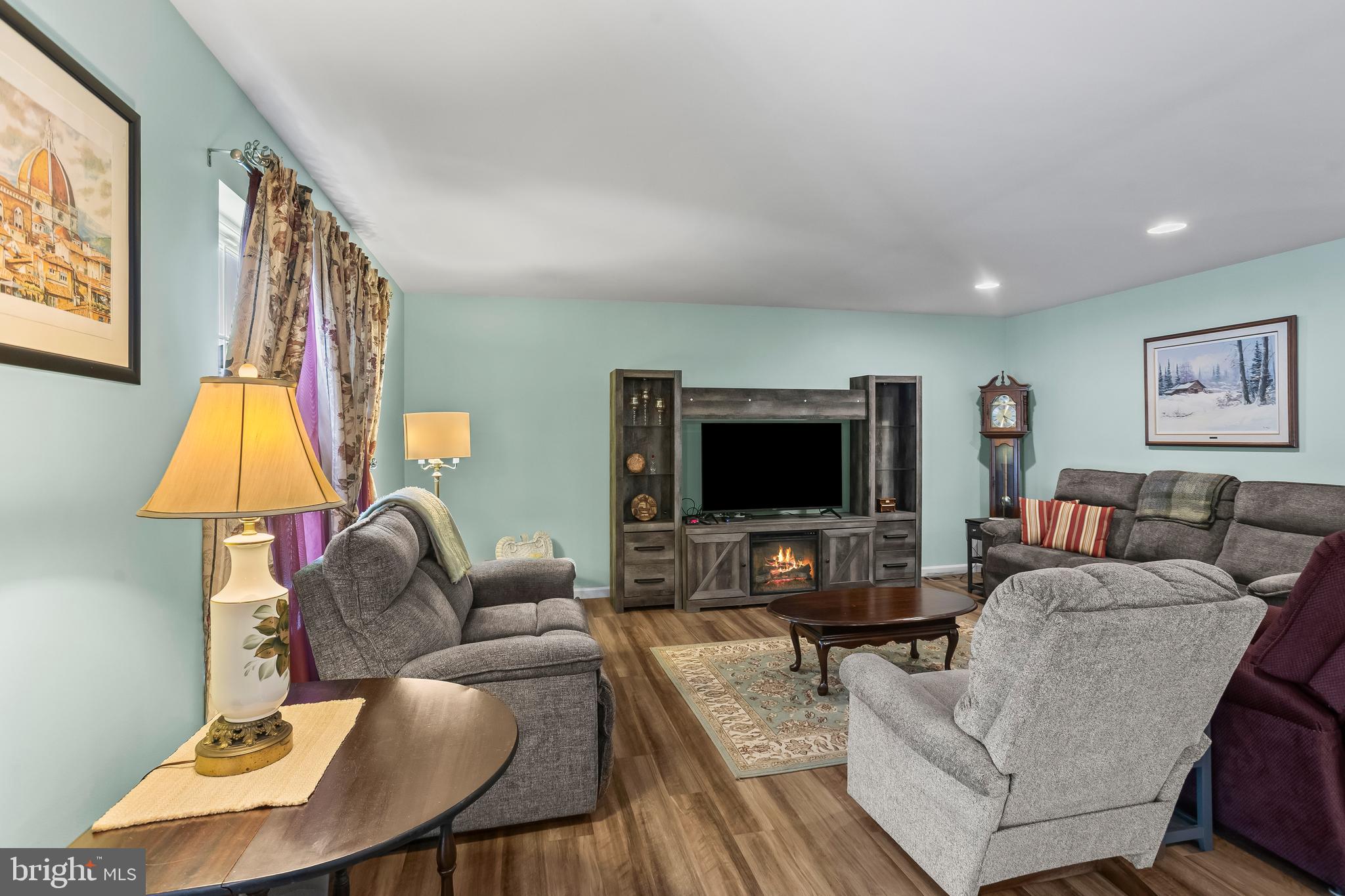 2069 Spring Wood Lane Mechanicsburg, PA 17055 - Photo 13 of 41 a living room with furniture and a flat screen tv