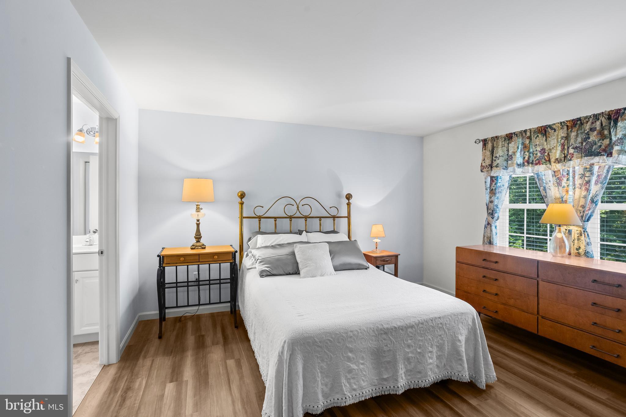 2069 Spring Wood Lane Mechanicsburg, PA 17055 - Photo 20 of 41 a bedroom with a bed and wooden floor