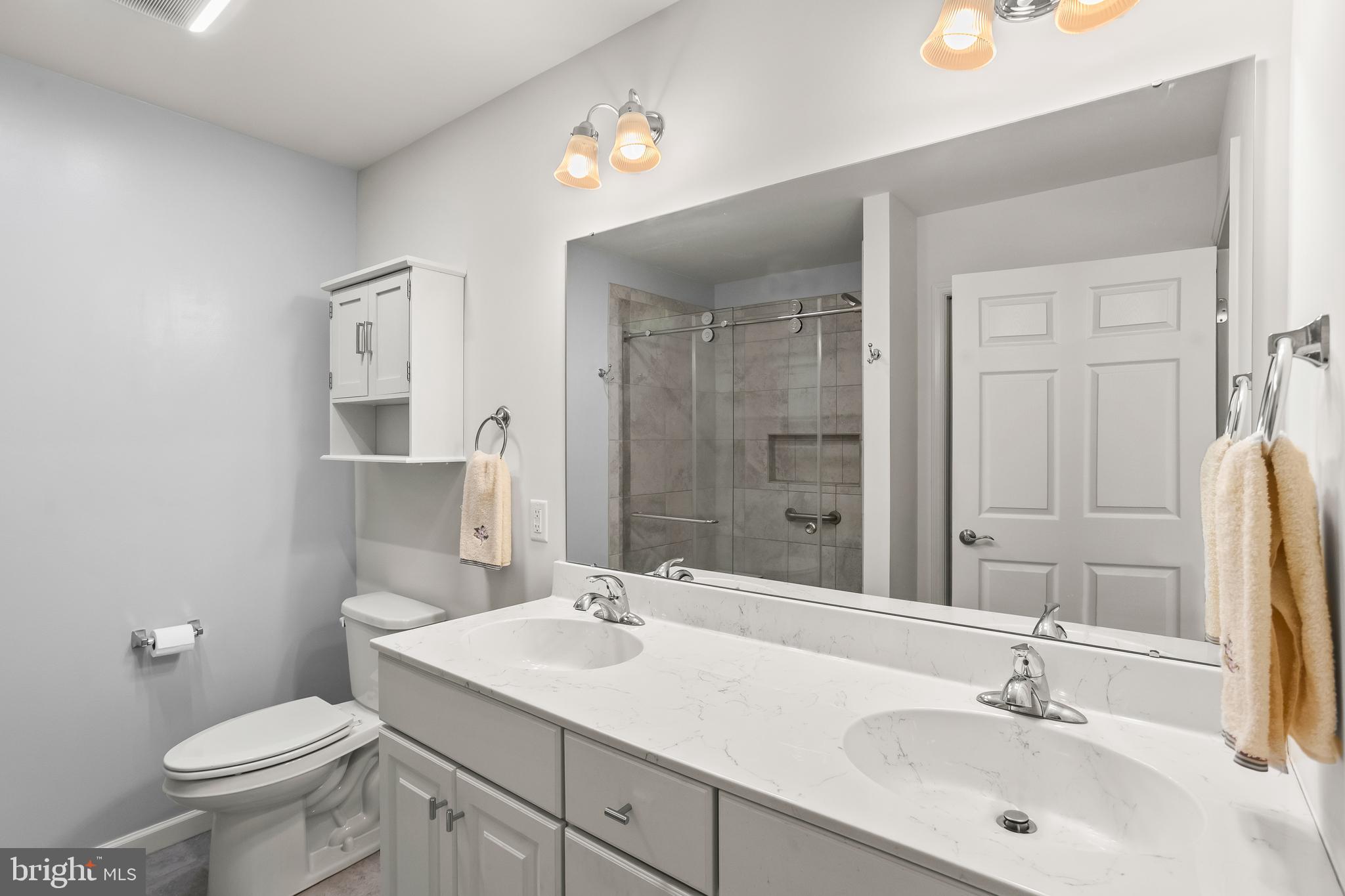 2069 Spring Wood Lane Mechanicsburg, PA 17055 - Photo 24 of 41 a bathroom with a sink toilet and shower