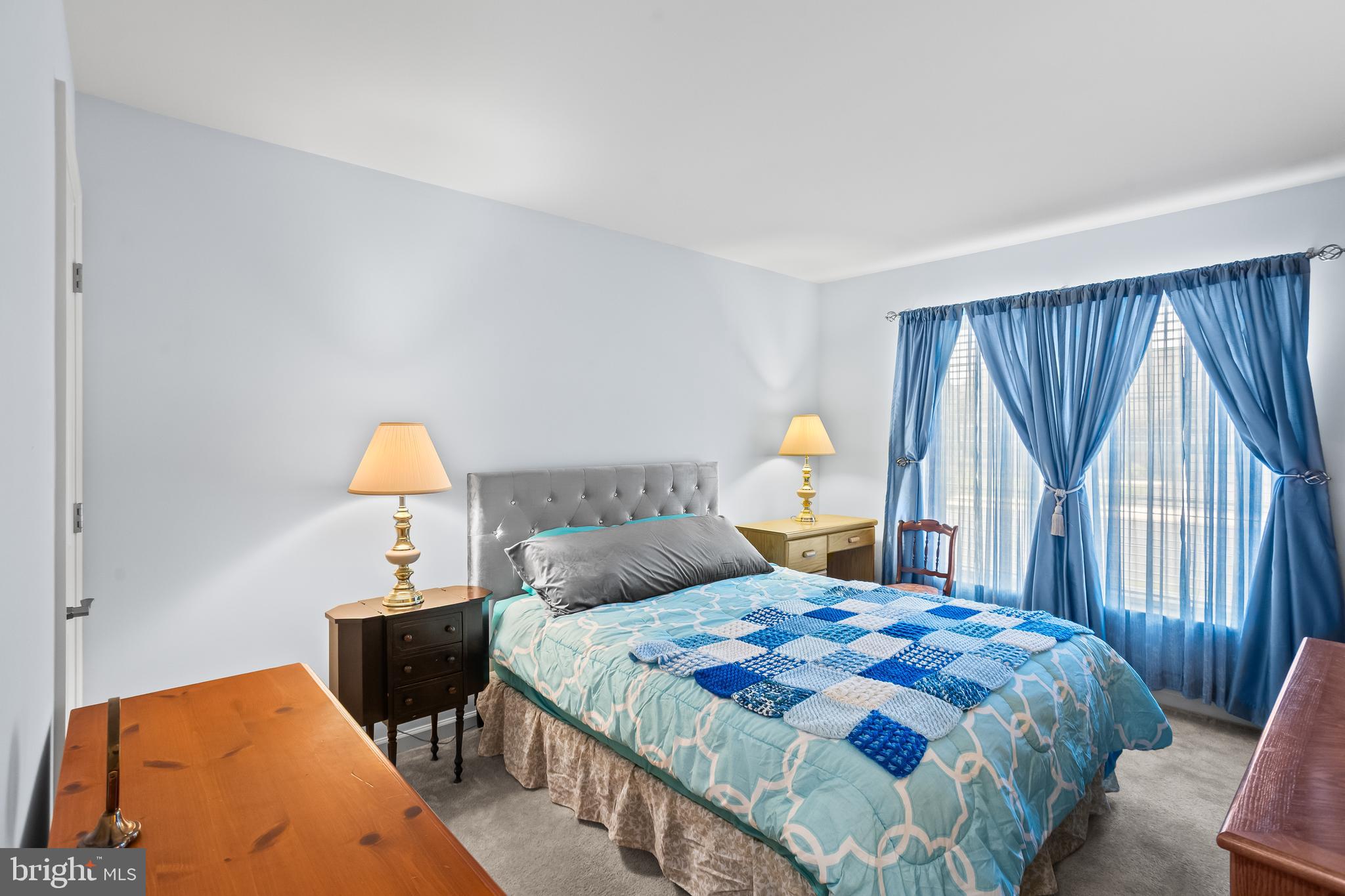 2069 Spring Wood Lane Mechanicsburg, PA 17055 - Photo 26 of 41 a bedroom with a bed and a lamp