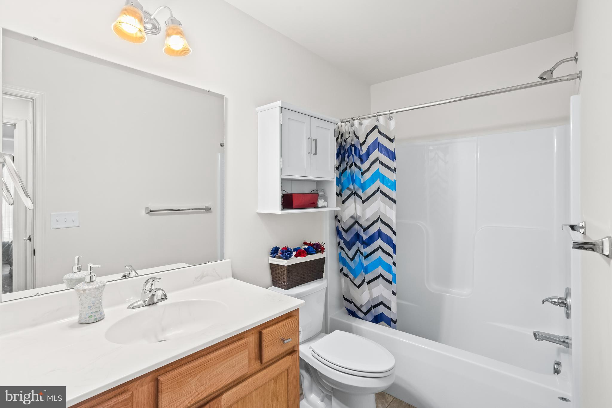 2069 Spring Wood Lane Mechanicsburg, PA 17055 - Photo 29 of 41 a bathroom with a sink mirror vanity and toilet