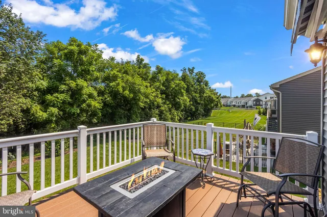 a view of a chair and table on the deck