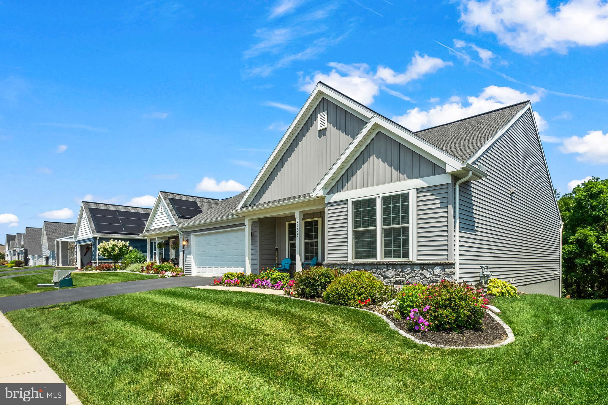 2069 Spring Wood Lane Mechanicsburg, PA 17055 - Photo 6 of 41 a view of a house with a yard and garden