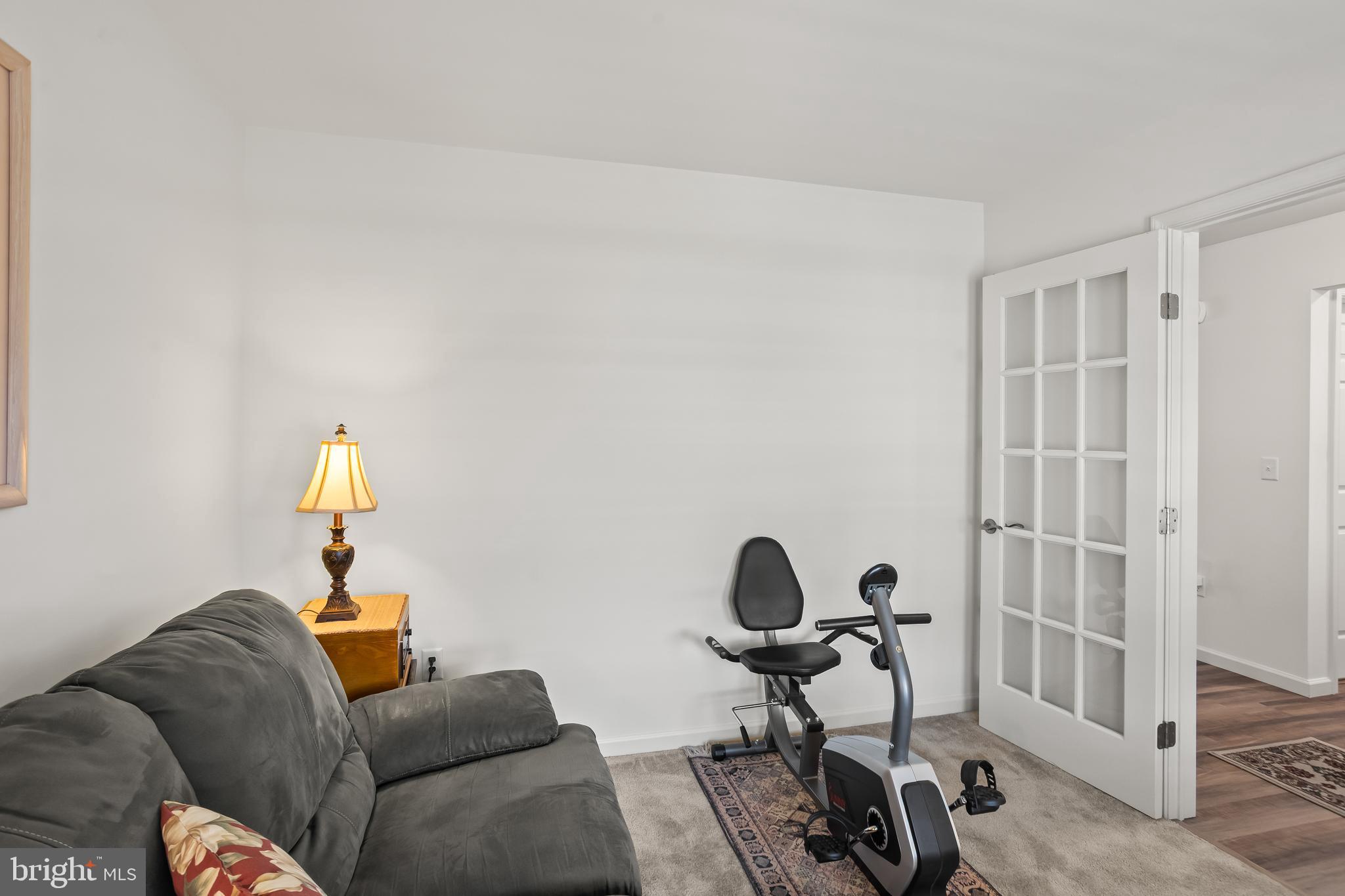 2069 Spring Wood Lane Mechanicsburg, PA 17055 - Photo 10 of 41 a living room with furniture a rug and a window
