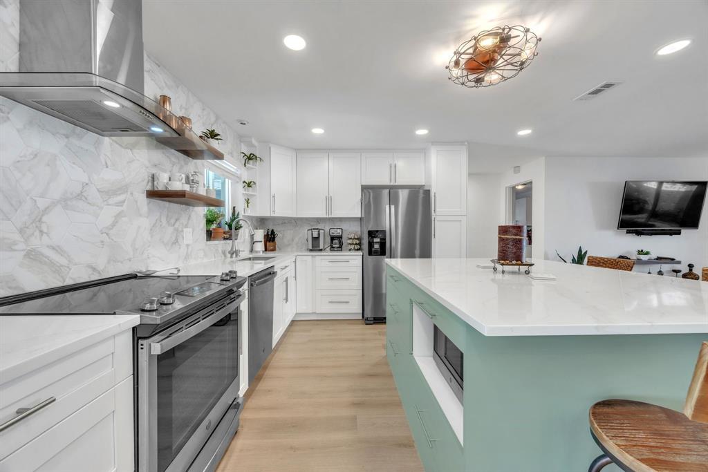 1611 Southwest 3rd Avenue Pompano Beach, FL 33060 - Photo 1 of 35 a kitchen with a sink stainless steel appliances furniture and a window