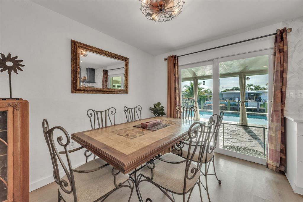 1611 Southwest 3rd Avenue Pompano Beach, FL 33060 - Photo 15 of 35 a view of a dining room with furniture window and outside view