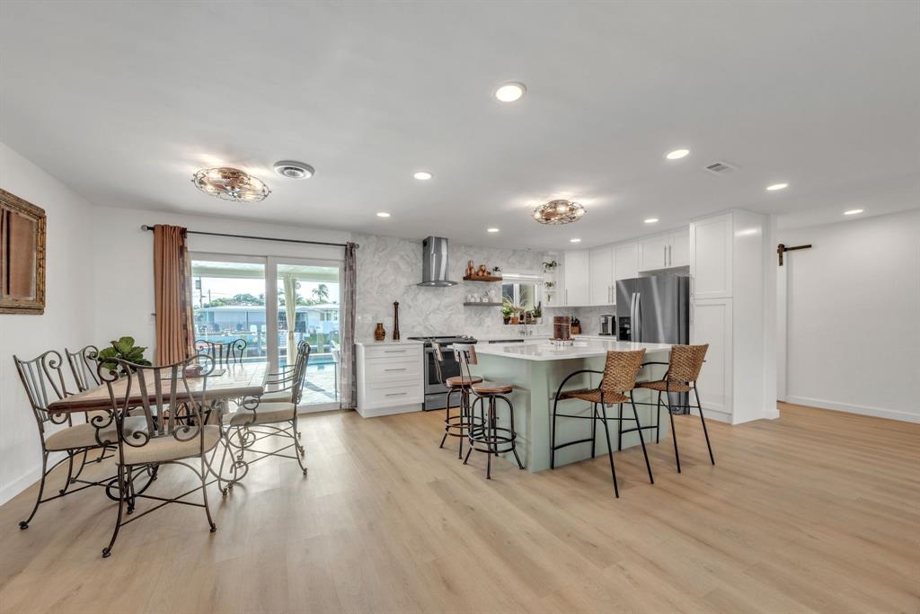 1611 Southwest 3rd Avenue Pompano Beach, FL 33060 - Photo 18 of 35 a view of a dining room with furniture window and wooden floor