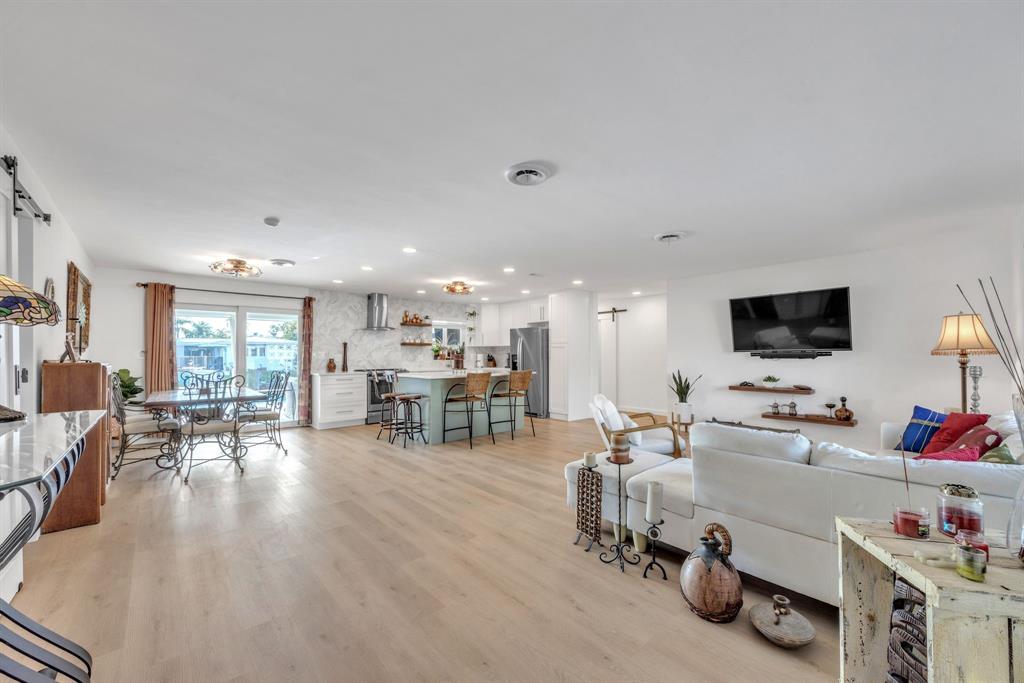 1611 Southwest 3rd Avenue Pompano Beach, FL 33060 - Photo 2 of 35 a room with furniture and a flat screen tv