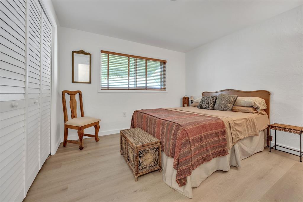 1611 Southwest 3rd Avenue Pompano Beach, FL 33060 - Photo 22 of 35 a bedroom with a bed chair and window