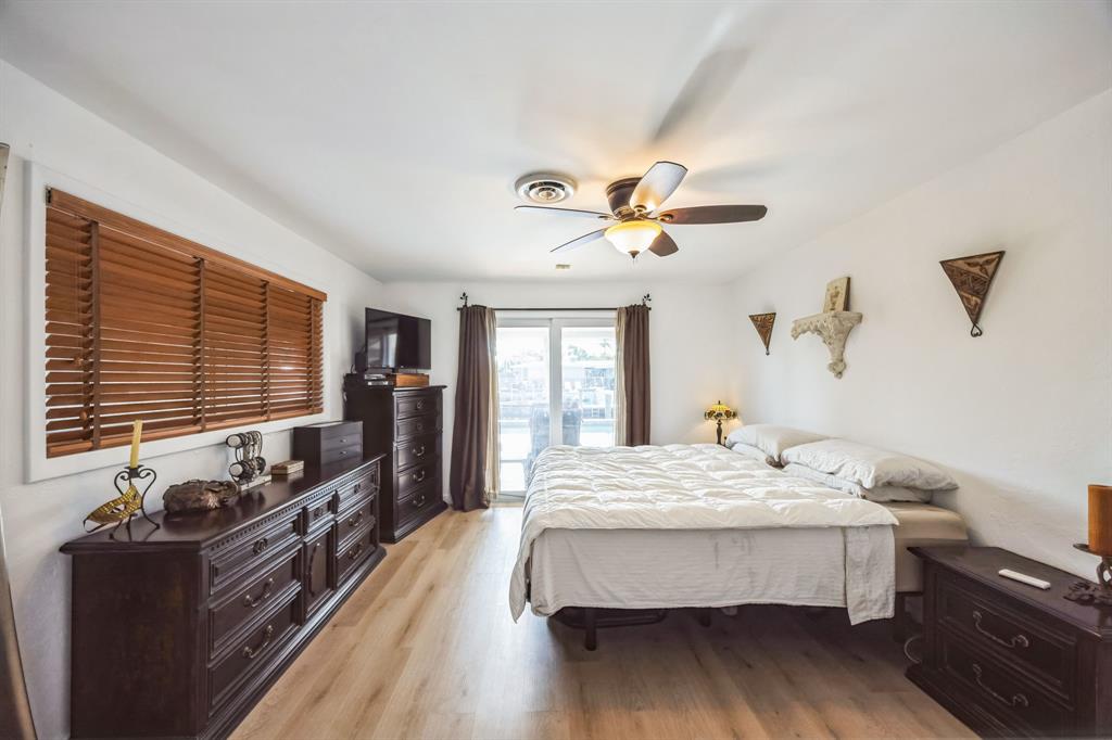 1611 Southwest 3rd Avenue Pompano Beach, FL 33060 - Photo 3 of 35 a bedroom with a bed and wooden floor