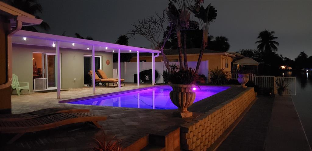 1611 Southwest 3rd Avenue Pompano Beach, FL 33060 - Photo 32 of 35 an outdoor sitting area with red umbrella