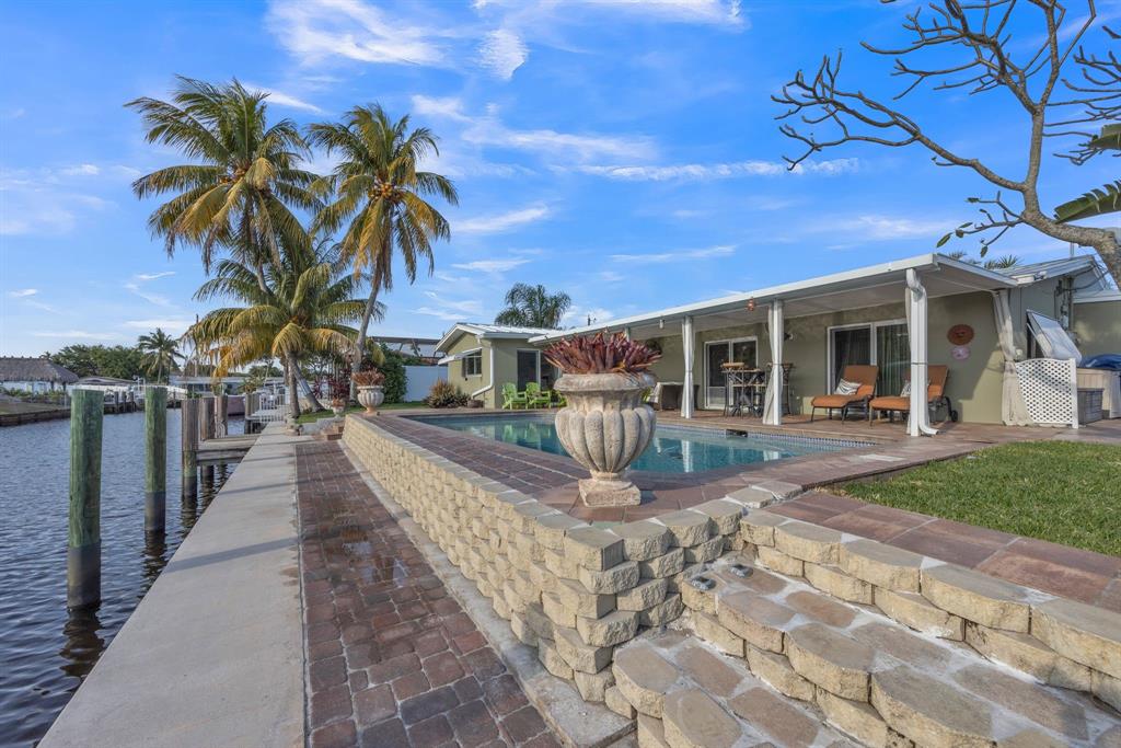 1611 Southwest 3rd Avenue Pompano Beach, FL 33060 - Photo 8 of 35 a view of a house with backyard and sitting area