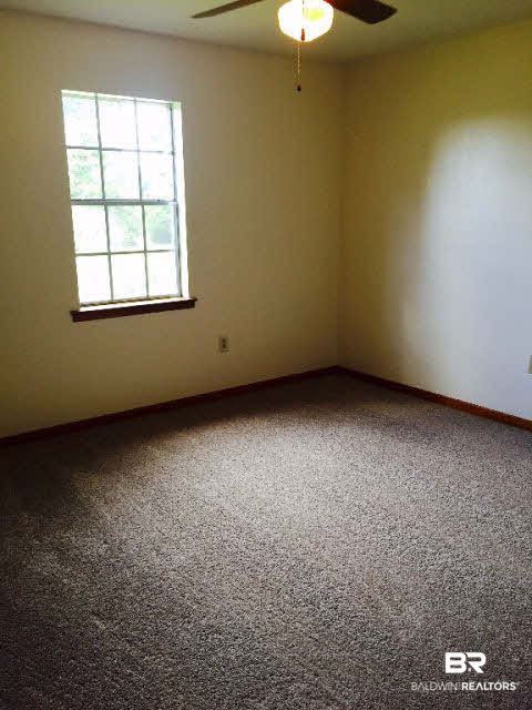 39660 Hannis Williams Road Bay Minette, AL 36507 - Photo 17 of 32 For Sale: 39660 Hannis Williams Road, Bay Minette, AL 36507 Bedroom 2 with 1 window and closet and new carpet
