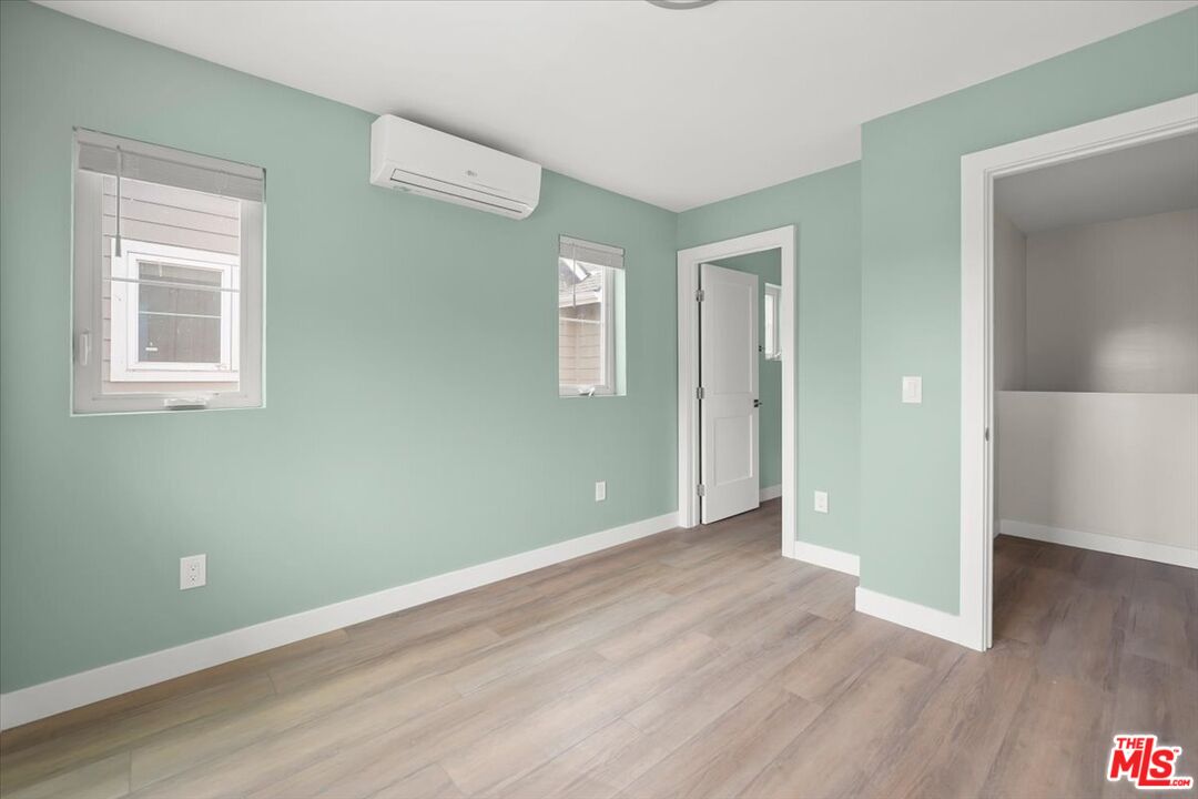 1317 Punta Gorda Street, Unit 9 Santa Barbara, CA 93103 - Photo 20 of 70 an empty room with wooden floor and a window
