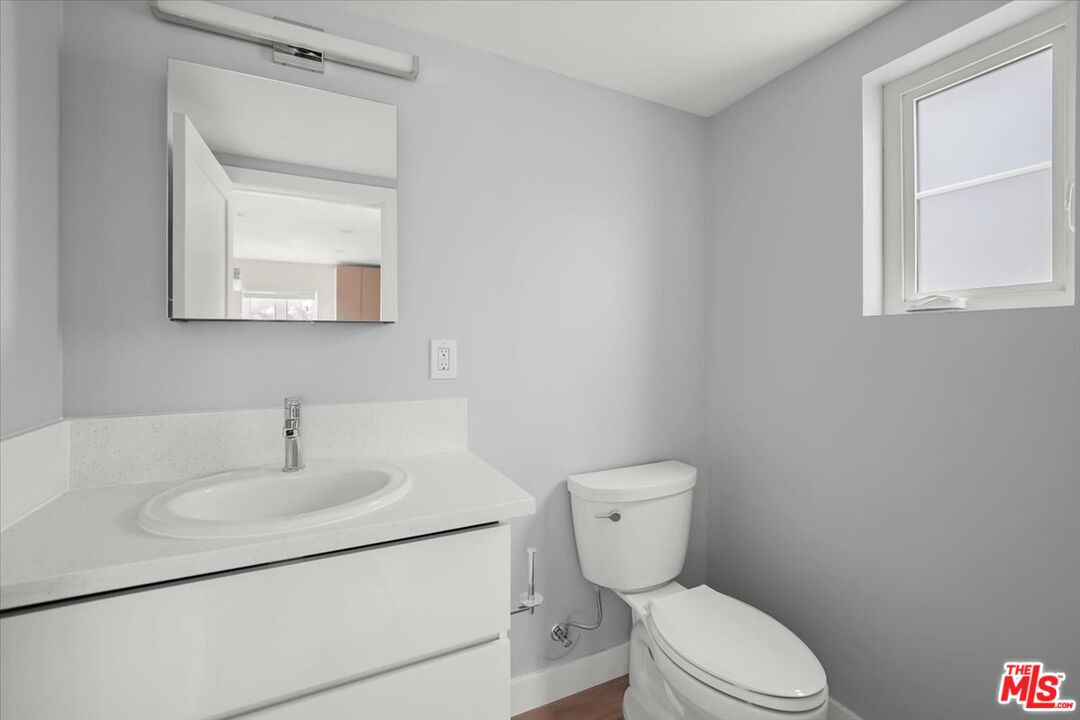 1317 Punta Gorda Street, Unit 9 Santa Barbara, CA 93103 - Photo 27 of 70 a bathroom with a toilet sink and mirror
