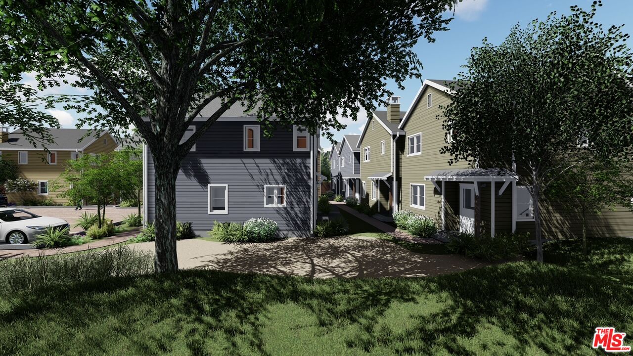 1317 Punta Gorda Street, Unit 9 Santa Barbara, CA 93103 - Photo 65 of 70 a view of a brick house with a yard and large trees