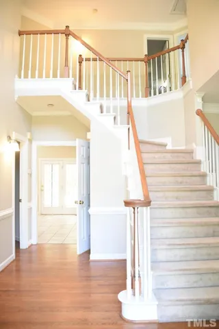 a view of entryway and hall with wooden floor